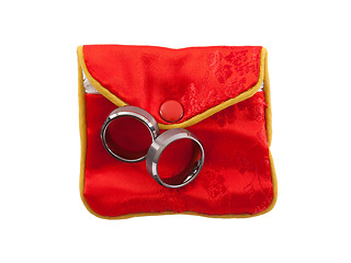 Image showing Wedding rings on a red pouch