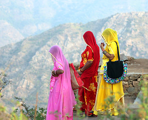 Image showing Indian women in colorful saris on top of hill