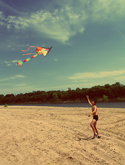 Image showing asian boy running kite - vintage retro style