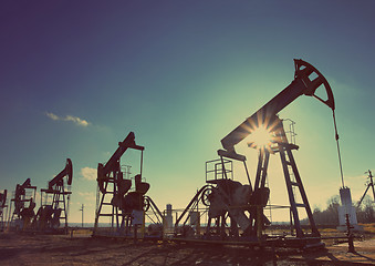 Image showing working oil pumps silhouette - vintage retro style