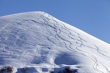 Image showing Off piste slope with trace of skis on snow