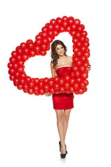 Image showing Love woman holding red heart shaped balloons