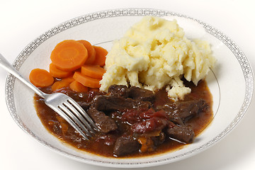 Image showing Beef and tomato casserole with fork