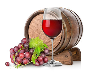 Image showing Wineglass with grape and barrel