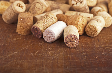 Image showing bottle corks on the wooden background