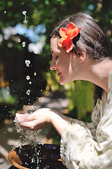 Image showing splashing fresh water on woman hands