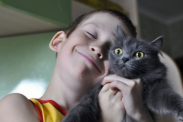 Image showing portrait of the happy boy with a cat.