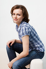 Image showing girl in a plaid shirt and jeans