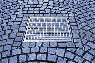 Image showing Paving stones with metal manhole