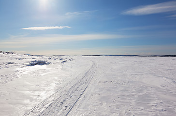 Image showing Snowmobile trail stretching into the distance to the horizon 