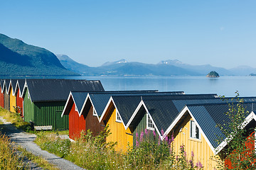 Image showing Colorful camping cabins on the fjord shore