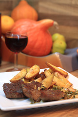 Image showing beef steaks with potatoes and wine