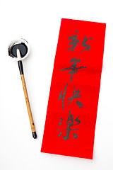 Image showing Writing of chinese new year calligraphy, phrase meaning is happy