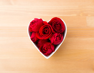 Image showing Rose in red inside heart shape bowl