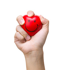 Image showing Hand squeezing a stress ball