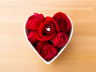 Image showing Rose with diamond ring inside the heart shape bowl