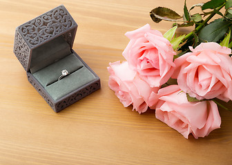 Image showing Engagement ring and pink rose 