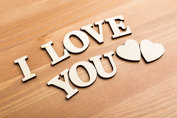 Image showing Wooden texture letters forming with phrase I Love You 