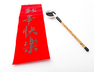 Image showing Writing of Lunar new year calligraphy, phrase meaning is happy n