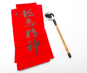 Image showing Writing of chinese new year calligraphy, phrase meaning is bless