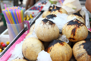Image showing Young coconut drinks on street 