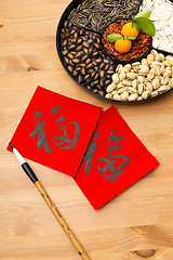 Image showing Chinese new year snack box and chinese calligraphy, meaning for 