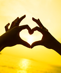 Image showing Silhouette hand in heart shape