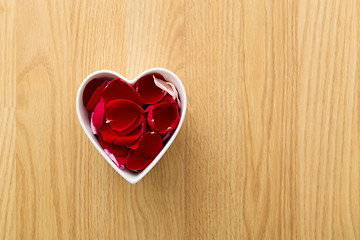 Image showing Rose pedal in heart bowl