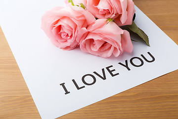 Image showing Pink rose and gift card of message I Love You