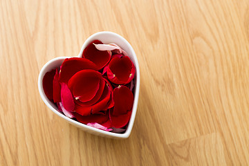 Image showing Rose petal in heart bowl