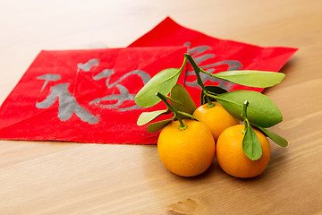 Image showing Chinese new year calligraphy and kumquat, word meaning is good l