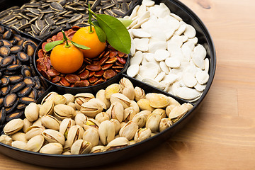 Image showing Chinese new year snack tray and citrus fruit 