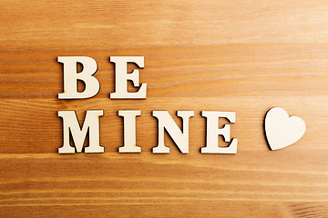 Image showing Be mine wooden text