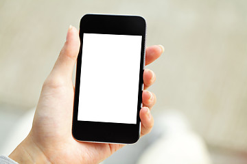 Image showing Hand holding mobile phone with blank screen