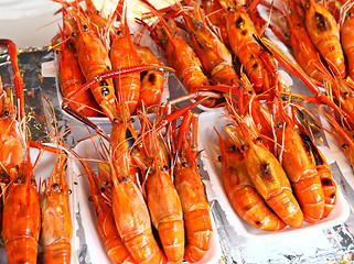 Image showing Prawns grilled on a street market 