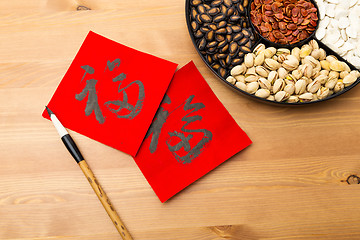 Image showing Assorted chinese sytle snack tray and chinese calligraphy, meani