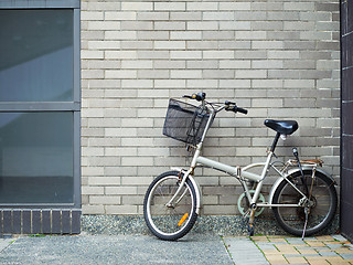 Image showing Bicycle and brick wall