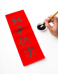 Image showing Writing of Lunar new year calligraphy, phrase meaning is happy n