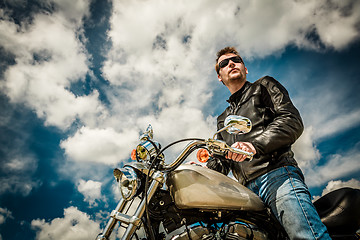 Image showing Biker on a motorcycle