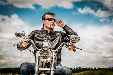 Image showing Biker on a motorcycle