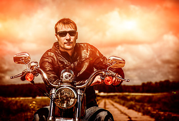 Image showing Biker on a motorcycle