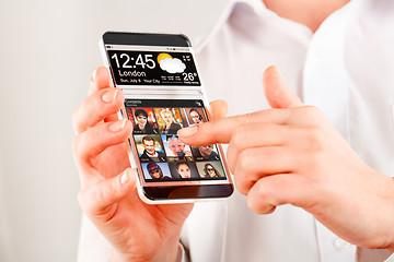 Image showing Smartphone with transparent screen in human hands.