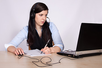 Image showing Young woman with headset