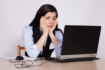Image showing Young woman desperate at the laptop