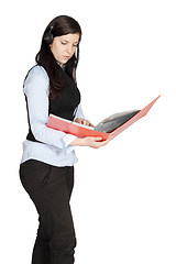 Image showing Young woman with a headset and documents