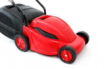 Image showing new red lawnmower on white background