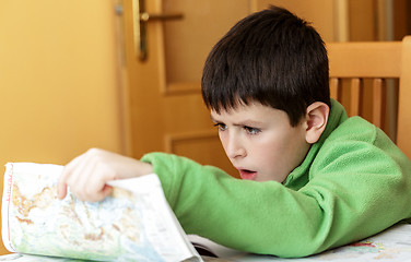 Image showing bored and tired boy doing homework