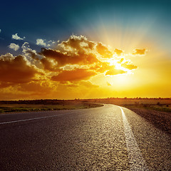 Image showing orange sunset over asphalt road