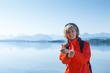 Image showing Woman tourist showing thumbs up