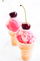 Image showing Ice cream cones with cherries